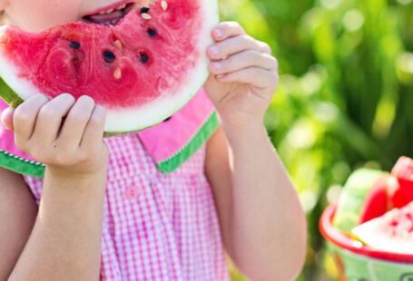 Healthy Eating Children - Girl Eating Sliced Watermelon Fruit Beside Table