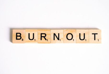 Burnout - Close-Up Shot of Scrabble Tiles on a White Surface
