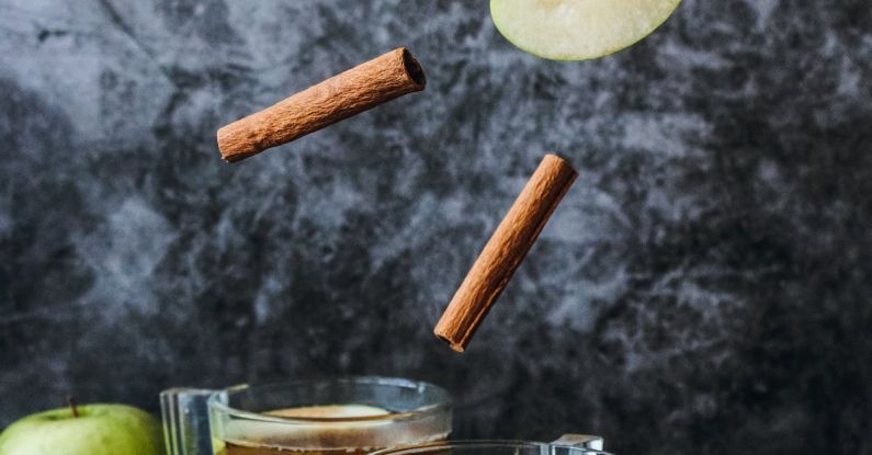 Apple Cider Vinegar - Photo of Slice Green Apple and Cinnamon Stick
