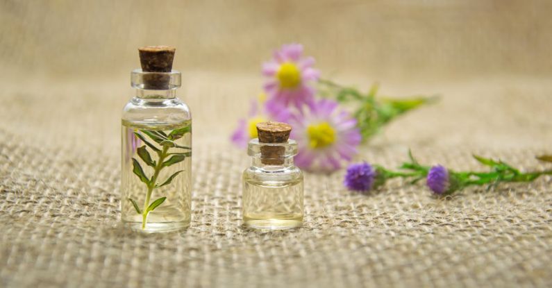 Essential Oils - Two Clear Glass Bottles With Liquids